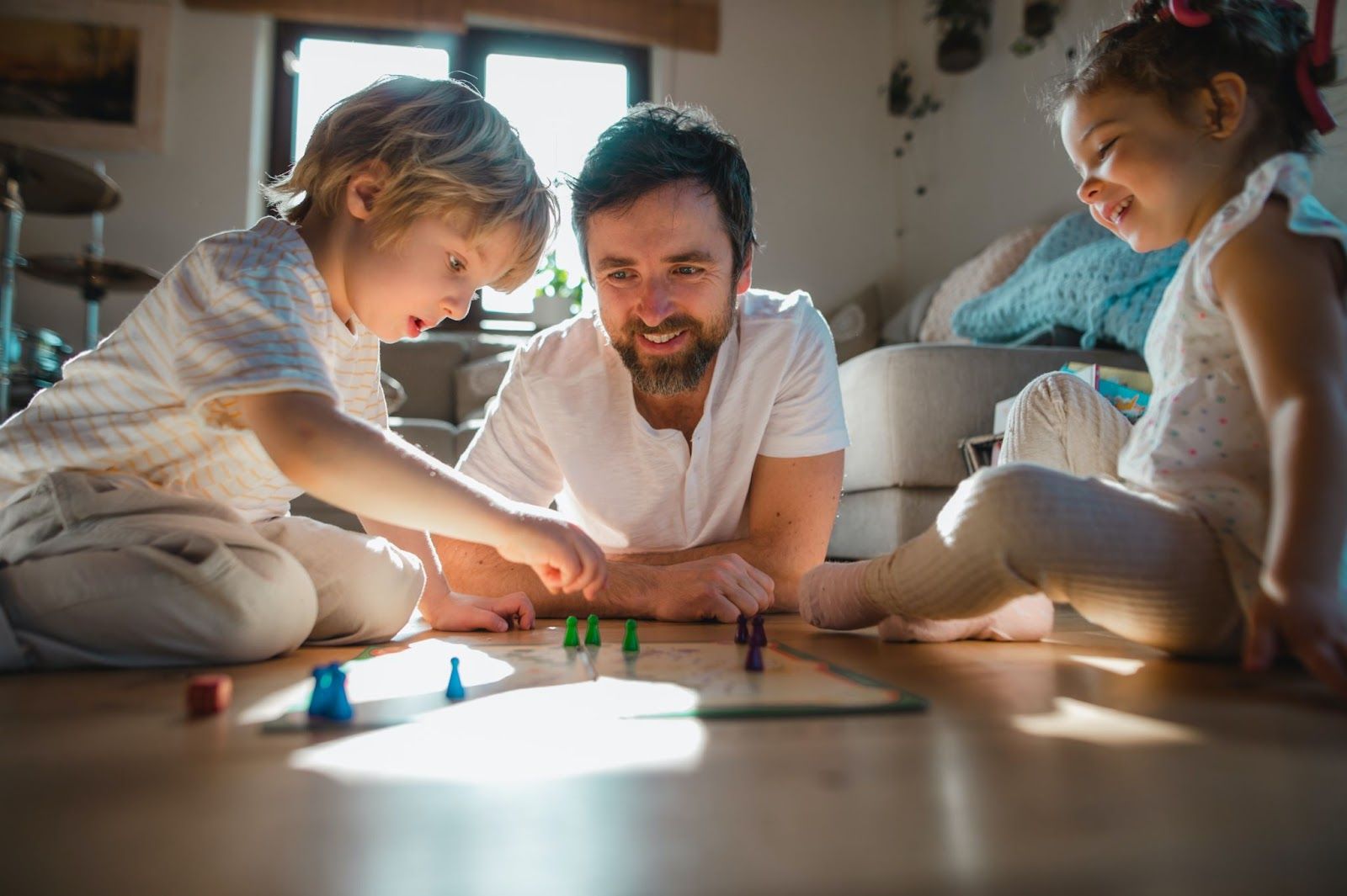 A man playing board games with his kids