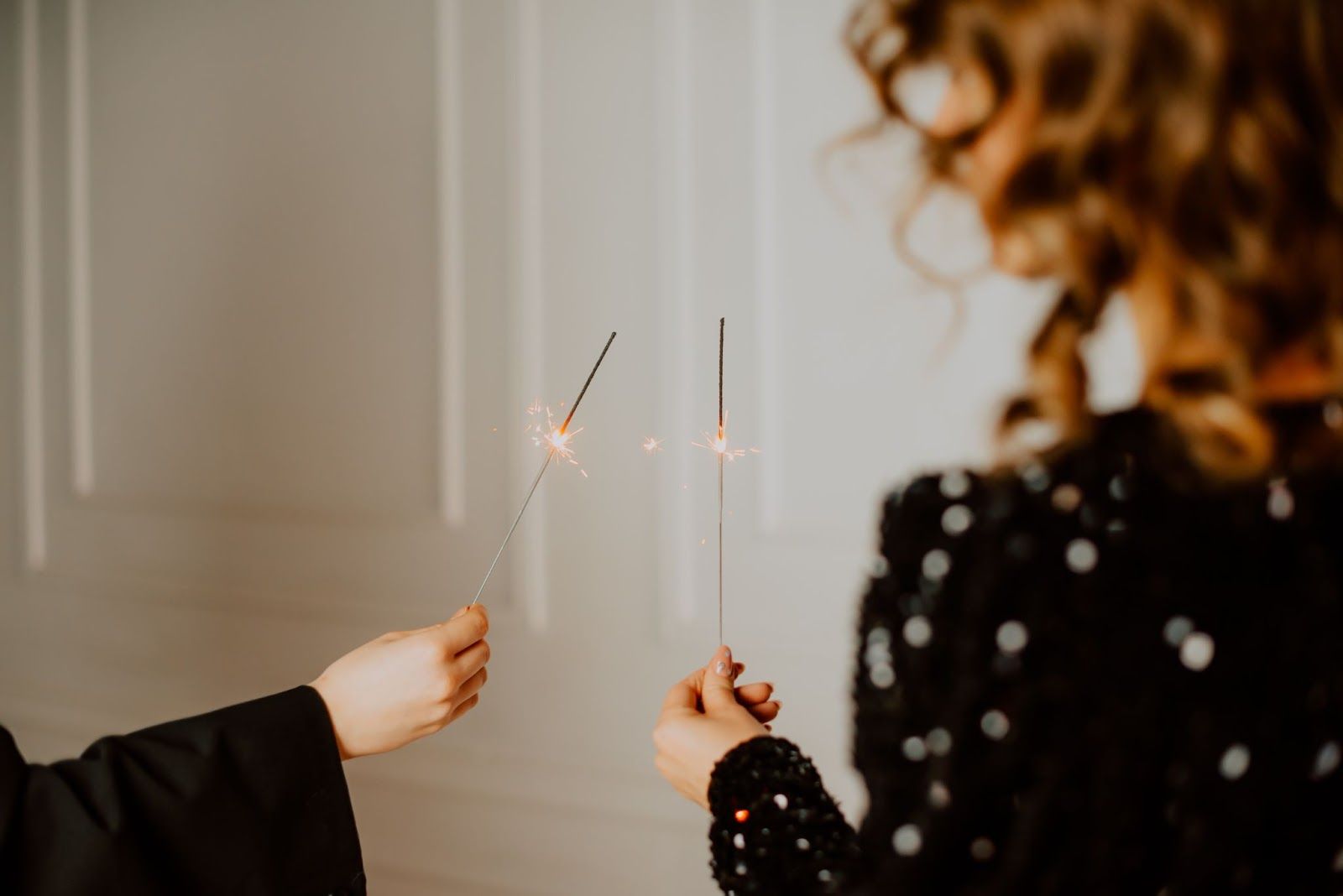 Two people holding sparklers